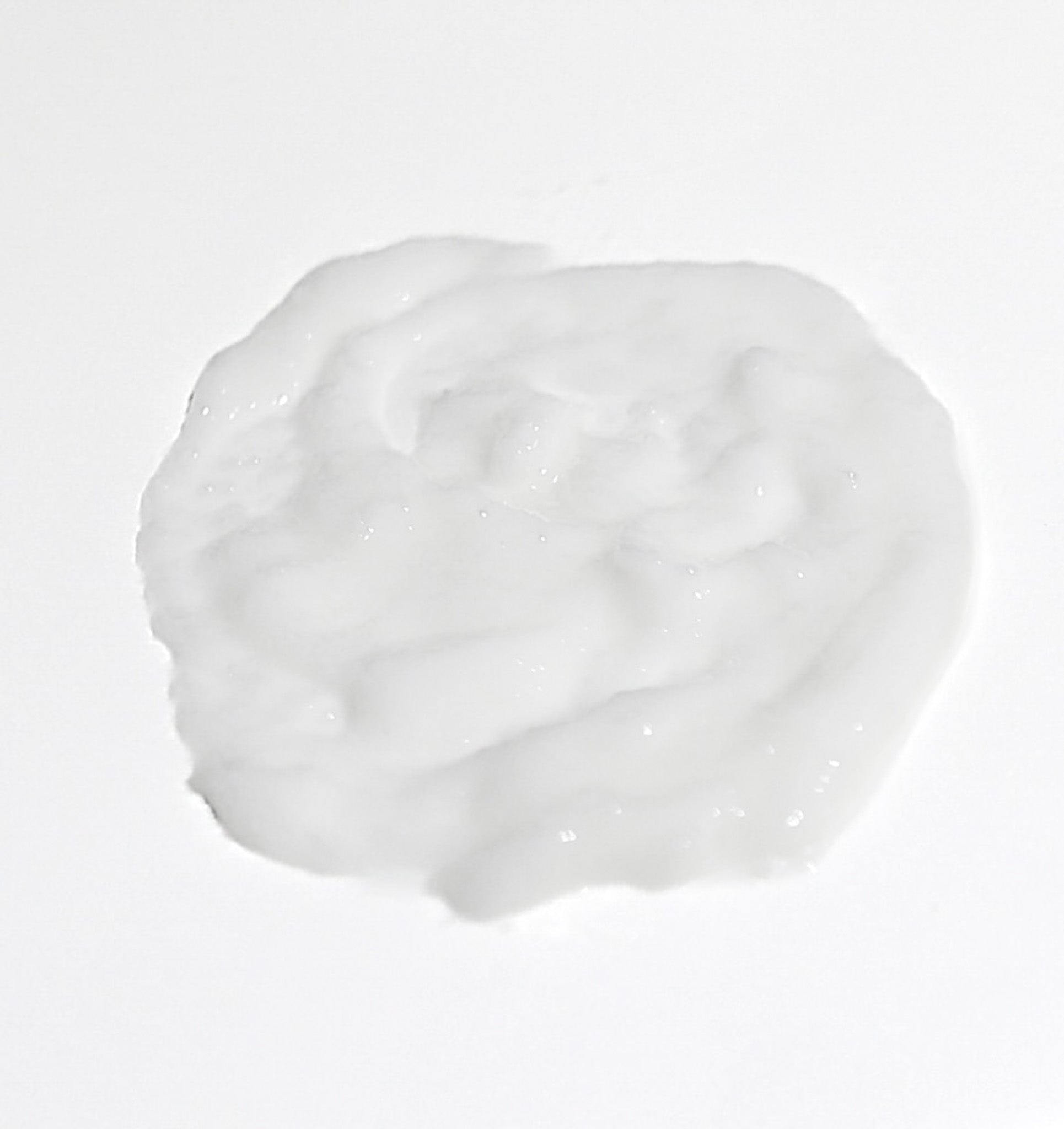 A tube of Berla Beauty Mint Exfoliating Facial Polish stands against a neutral background. The product, labeled "Mint Exfoliating Facial Polish with Apricot Oil," is designed for facial use. The tube features a simple, clean design with black and white text.